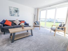 A living room with a sofa and coffee table at Seafern House 36B in Poole