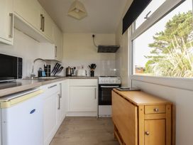 A kitchen with appliances and cabinets at Stanbury in St Merryn