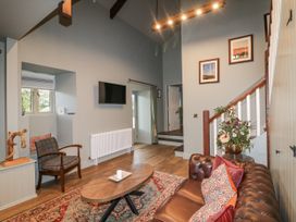 A living room with a sofa and coffee table at Robins Rest at The Lodge Kilmacthomas