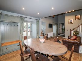 A dining room with a table and chairs at Robins Rest at The Lodge Kilmacthomas
