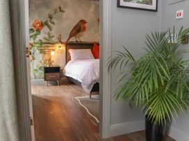 A bedroom with a bed and a nightstand at Robins Rest at The Lodge, Ahanaglogh near Kilmacthomas, County Waterford
