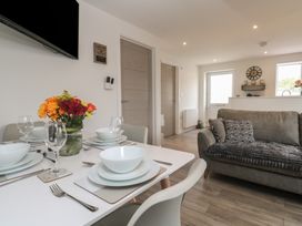 A dining room with a table set for dinner at Cosy Retreat in 
