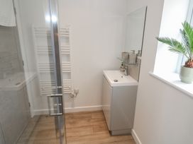 A bathroom with a shower and sink at Cosy Retreat in 