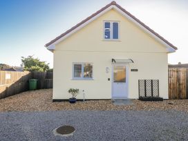 A house with a front door and gravel area at Cosy Retreat in Pool