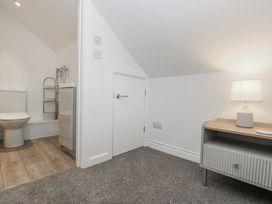 A bathroom with a toilet and sink at Cosy Retreat Pool