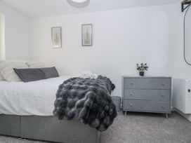 A bedroom with a bed and a dresser at Cosy Retreat in Pool