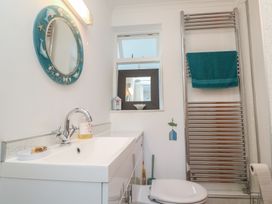 A bathroom with a sink and toilet at Sea Whispers in Marazion