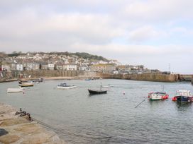 A harbor with boats in the water at Sea Whispers Marazion