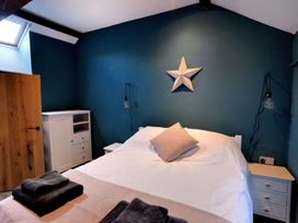 A bedroom with a bed and bedside tables at proposed 3 bed apartment in Lyme Regis