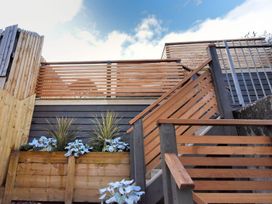 An outdoor staircase with wooden fencing and planters at proposed 3 bed apartment Lyme Regis