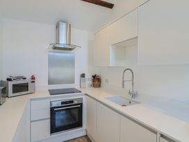 A kitchen with appliances and countertops at Avocet in Lyme Regis