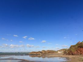 A beach with sand and water at 3 Brooks Cottages in Hope Cove