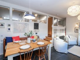 A dining room with a table and chairs at 3 Brook Cottages Hope Cove