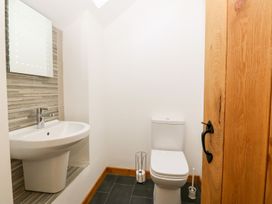 A bathroom with a sink and toilet at The Old Barn in Pwllheli