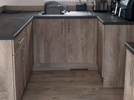 A kitchen with a sink and cabinets at 30 Wells Close in Berwick-upon-Tweed