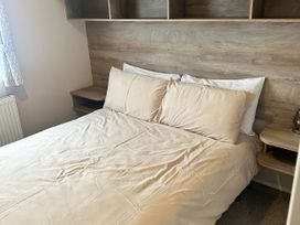 A bedroom with a bed and bedside table at 30 Wells Close Berwick-upon-Tweed