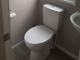 A bathroom with a toilet and sink at 30 Wells Close in Berwick-upon-Tweed