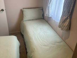 A bedroom with two beds and a window at 30 Wells Close Berwick-upon-Tweed