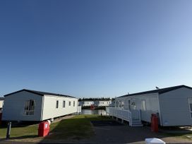 Mobile homes by a waterway at 30 Wells Close in Berwick-upon-Tweed