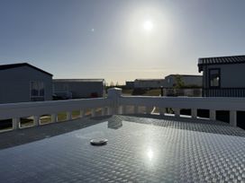 An outdoor space with a glass table and coin at 30 Wells Close Berwick-upon-Tweed
