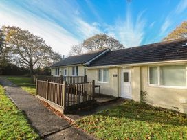 An outdoor area with a house and deck at Little Egret - Number 2