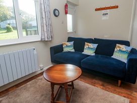 A living room with a sofa and coffee table at Little Egret - Number 2