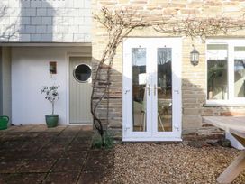An outdoor area featuring a door, window, and potted plant at The Mizzen in St Endellion near Port Isaac