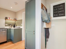 A kitchen with a sink and appliances at The Mizzen St Endellion near Port Isaac