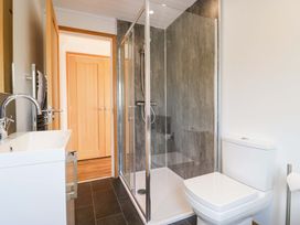 A bathroom with a shower and sink at Bluebell Lodge in Warton