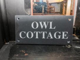A sign for Owl Cottage in Woodbridge