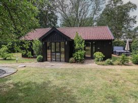 A house with a garden and pathway at Owl Cottage in Kettleburgh near Framlingham