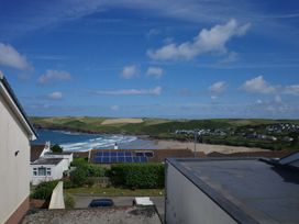 A view of the beach and coastline from a property at Badgers Cliff in Polzeath