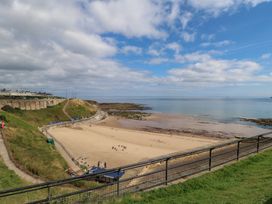 A beach with sand and water at Chalet 86 in North Shields