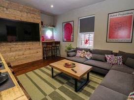 A living room with a sofa and coffee table at Chalet 86 in Tynemouth