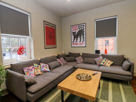 A living room with a sofa and coffee table at Chalet 86 in Tynemouth