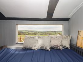 A snug with pillows and a view at The Bus on the Hill 