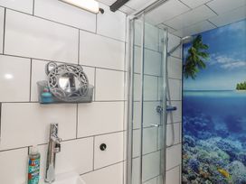 A bathroom with shower and sink at The Bus on the Hill