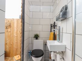 A bathroom with toilet and sink at The Bus on the Hill 