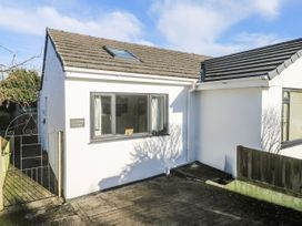 A house exterior with a garden gate at Blake Lodge in Crantock