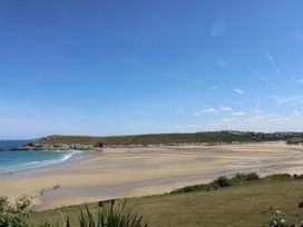 A beach with sand and sea at Blake Lodge in Crantock