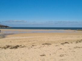 A beach with sand and ocean at 237 - Penkalick in Padstow