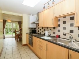 A kitchen with cabinets and countertops at Orchard Cottage in Corse near Gloucester