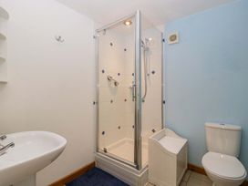A bathroom with a shower and toilet at Orchard Cottage in Corse near Gloucester