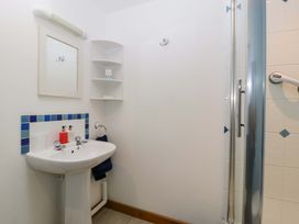 A bathroom featuring a sink and shower at Orchard Cottage in Corse near Gloucester