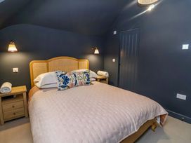 A bedroom with a bed and bedside tables at 52 Lee Road in Aldeburgh