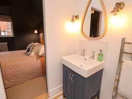 A bathroom with a sink and mirror at 52 Lee Road in Aldeburgh