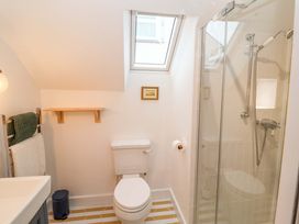 A bathroom with a shower and toilet at 52 Lee Road in Aldeburgh