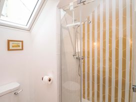 A bathroom with a shower and toilet at 52 Lee Road Aldeburgh
