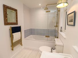 A bathroom with a bathtub and shower at 52 Lee Road, Aldeburgh