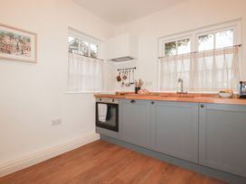 A kitchen with countertops and appliances at Copper Mine Cottage in Bodmin